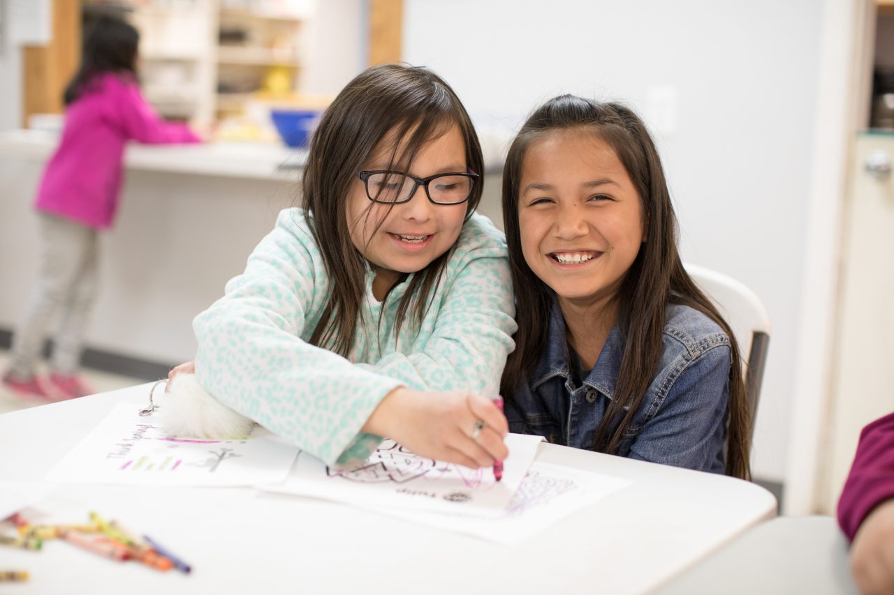 Todd County, South Dakota, 2019. Leighauna Marshall and Leah Long Crow at the Boys and Girls Club in Mission, South Dakota. The site offers many programs and serves the local community in many ways.
The Boys and Girls Club of Rosebud provides supplemental academic services, year round. They are committed to helping youth on their road to high school graduation and beyond. To encourage learning outside of the classroom, they provide enriching programming in: math, reading, science, and computer literacy.
Every child who walks through these doors receives a hot and nutritious meal.
The Boys and Girls Club believes that art is an expression of the imagination and personal voice and cultivates lifelong creative and critical thinking skills. Their youth take part in art classes every week, and are proud of what they can create with their ideas and their own two hands! Art lessons cover a wide variety of mediums such as such as painting, watercolor, stamping, collage, drawing, and much more. The club also holds special art classes such as ceramics, mural painting, photography, as well as traditional Lakota art projects.
